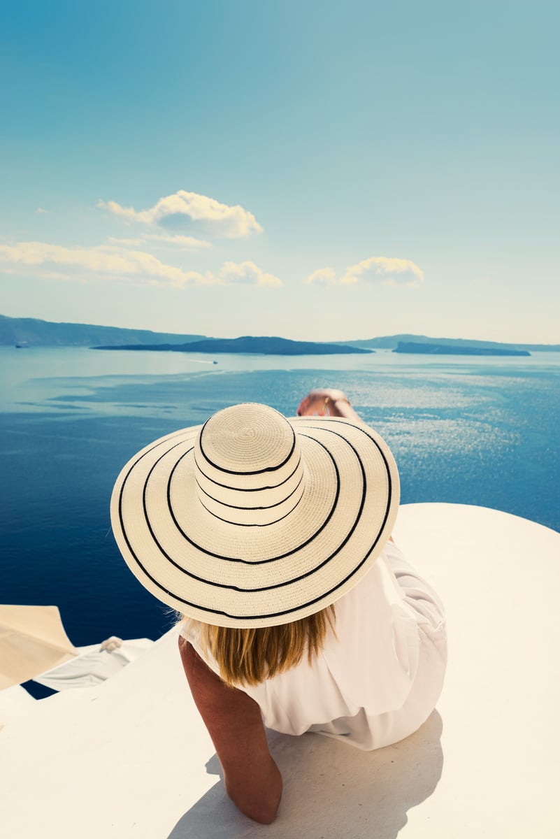 Luxury Travel Vacation Woman Looking at View on Santorini Island